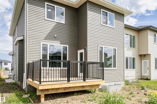 Rear view of house with a deck - 3248 Pelerin Crescent, Beaumont, AB - Outdoor With Deck Patio Veranda