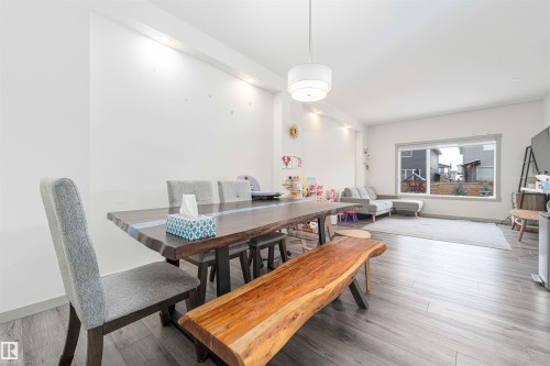 Dining area featuring wood finished floors and baseboards - 2330 Kelly Circle, Edmonton, AB - Indoor