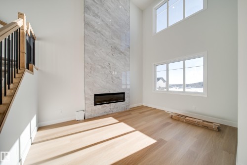 7027 177 Avenue, Edmonton, AB - Indoor Photo Showing Other Room With Fireplace