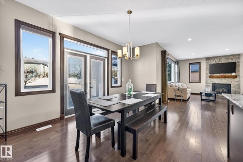 559 Westerra Boulevard, Stony Plain, AB - Indoor Photo Showing Dining Room With Fireplace