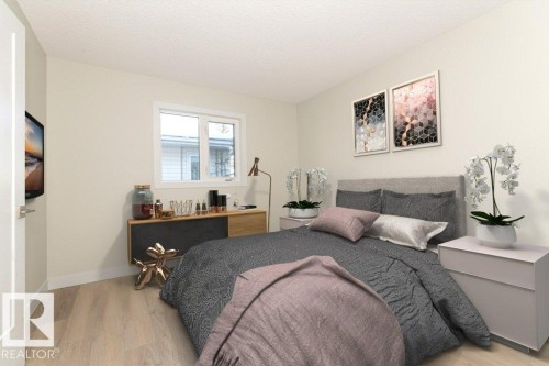 Bedroom with light wood-style floors and a textured ceiling - 5720 109A Street Nw, Edmonton, AB - Indoor Photo Showing Bedroom