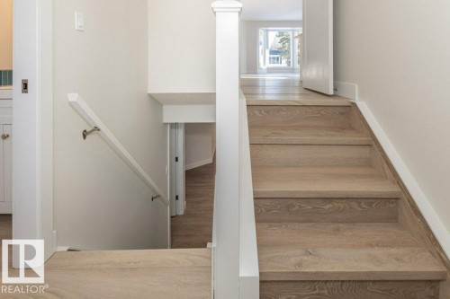 Stairs featuring wood finished floors - 5720 109A Street Nw, Edmonton, AB - Indoor Photo Showing Other Room