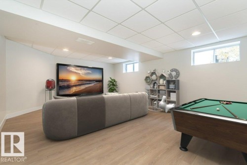 Rec room featuring billiards, light wood-type flooring, a drop ceiling, and recessed lighting - 5720 109A Street Nw, Edmonton, AB - Indoor Photo Showing Other Room