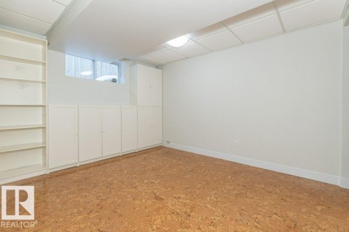 Basement featuring baseboards - 5720 109A Street Nw, Edmonton, AB - Indoor Photo Showing Other Room