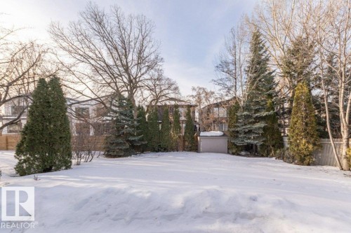Snowy yard with a storage unit - 5720 109A Street Nw, Edmonton, AB - Outdoor