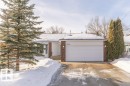 View of front facade with brick siding, driveway, and an attached garage - 5720 109A Street Nw, Edmonton, AB  - Outdoor 