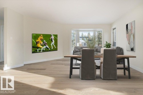 Dining area with light wood-type flooring and baseboards - 5720 109A Street Nw, Edmonton, AB - Indoor
