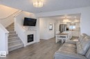 32 Southpointe Boulevard, Fort Saskatchewan, AB  - Indoor Photo Showing Living Room With Fireplace 