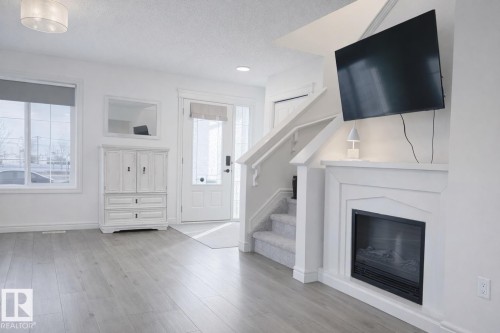 32 Southpointe Boulevard, Fort Saskatchewan, AB - Indoor Photo Showing Living Room With Fireplace