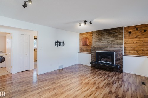 4102 43A Avenue, Leduc, AB - Indoor Photo Showing Living Room With Fireplace