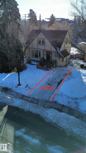 View of front of property with stone siding - 11507 72 Avenue Nw, Edmonton, AB - Outdoor With Body Of Water