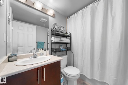Bathroom featuring vanity and shower / tub combo - 301 10118 106 Avenue, Edmonton, AB - Indoor Photo Showing Bathroom