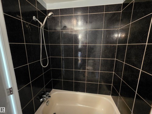 Bathroom featuring shower / bath combination - Edmonton, AB - Indoor Photo Showing Bathroom