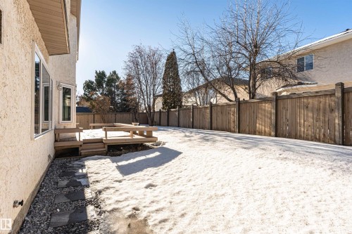 Fenced backyard with a deck - 607 Butterworth Wynd, Edmonton, AB - Outdoor