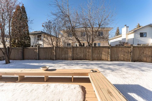 Deck featuring a fenced backyard and a residential view - 607 Butterworth Wynd, Edmonton, AB - Outdoor