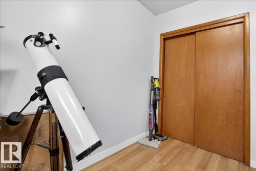 Interior space with wood finished floors and baseboards - 13320 123 Street, Edmonton, AB - Indoor Photo Showing Other Room