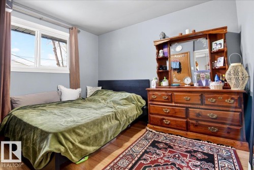 Bedroom featuring wood finished floors - 13320 123 Street, Edmonton, AB - Indoor Photo Showing Bedroom