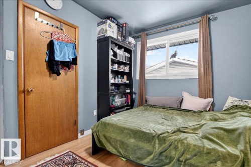 Bedroom featuring wood finished floors and baseboards - 13320 123 Street, Edmonton, AB - Indoor Photo Showing Bedroom