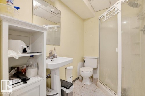 Bathroom featuring a stall shower and tile patterned flooring - 13320 123 Street, Edmonton, AB - Indoor Photo Showing Bathroom