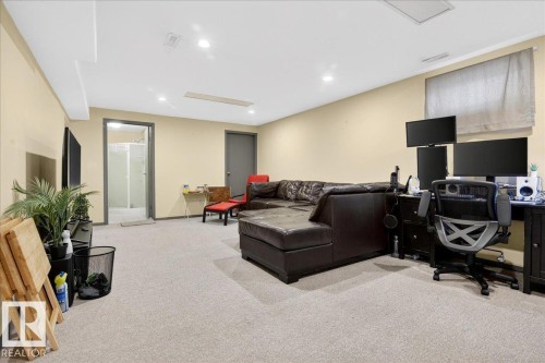 Living area with a desk, light carpet, and recessed lighting - 13320 123 Street, Edmonton, AB - Indoor