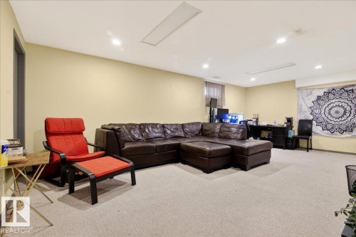 Living area with light colored carpet, recessed lighting, and a desk - 13320 123 Street, Edmonton, AB - Indoor Photo Showing Basement