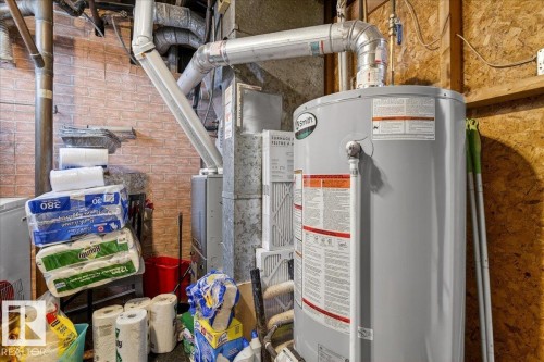 Utility room featuring water heater - 13320 123 Street, Edmonton, AB - Indoor Photo Showing Basement