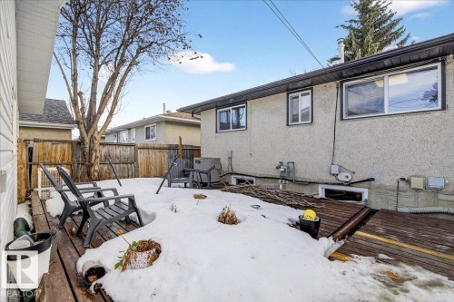 Rear view of property featuring stucco siding and a deck - 13320 123 Street, Edmonton, AB - Outdoor With Deck Patio Veranda With Exterior
