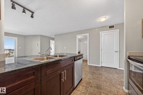 404 5370 Chappelle Road, Edmonton, AB - Indoor Photo Showing Kitchen With Double Sink