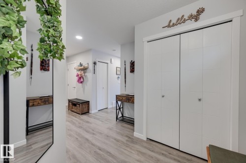Hall with light wood-type flooring and recessed lighting - 4 Caledon Crescent, Spruce Grove, AB - Indoor Photo Showing Other Room