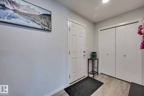 Entrance foyer featuring light wood finished floors and baseboards - 4 Caledon Crescent, Spruce Grove, AB - Indoor Photo Showing Other Room