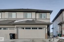 View of front of home with roof with shingles, stone siding, board and batten siding, and concrete driveway - 4 Caledon Crescent, Spruce Grove, AB  - Outdoor 