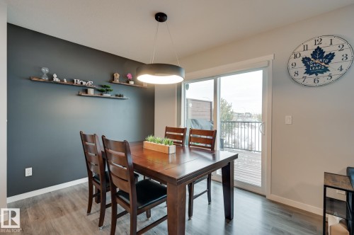 Dining room with baseboards and light wood-style floors - 4 Caledon Crescent, Spruce Grove, AB - Indoor Photo Showing Dining Room