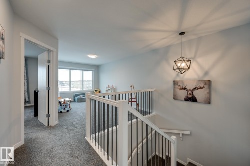 Hall featuring an upstairs landing and carpet floors - 4 Caledon Crescent, Spruce Grove, AB - Indoor Photo Showing Other Room