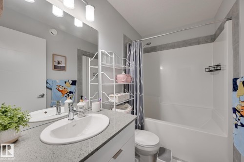 Full bathroom featuring shower / bathtub combination with curtain and vanity - 4 Caledon Crescent, Spruce Grove, AB - Indoor Photo Showing Bathroom