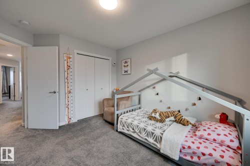 Bedroom featuring carpet and a closet - 4 Caledon Crescent, Spruce Grove, AB - Indoor Photo Showing Bedroom
