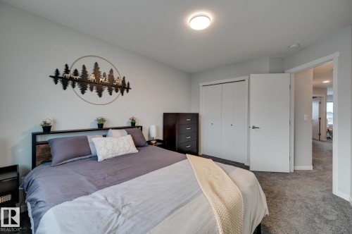 Carpeted bedroom featuring a closet and baseboards - 4 Caledon Crescent, Spruce Grove, AB - Indoor Photo Showing Bedroom