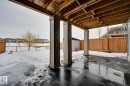 Snow covered patio with a fenced backyard and a patio - 4 Caledon Crescent, Spruce Grove, AB  - Outdoor With Exterior 