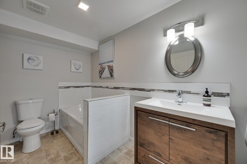 Bathroom featuring a garden tub and vanity - 4 Caledon Crescent, Spruce Grove, AB - Indoor Photo Showing Bathroom