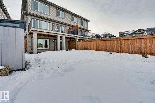 Snow covered rear of property with a balcony - 4 Caledon Crescent, Spruce Grove, AB - Outdoor With Deck Patio Veranda