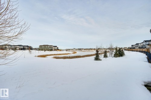Yard covered in snow with a residential view - 4 Caledon Crescent, Spruce Grove, AB - Outdoor With View