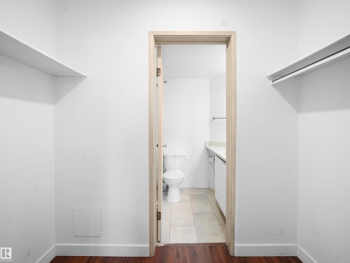 Walk in closet featuring light wood-style floors - 108 5065 31 Avenue, Edmonton, AB - Indoor With Storage
