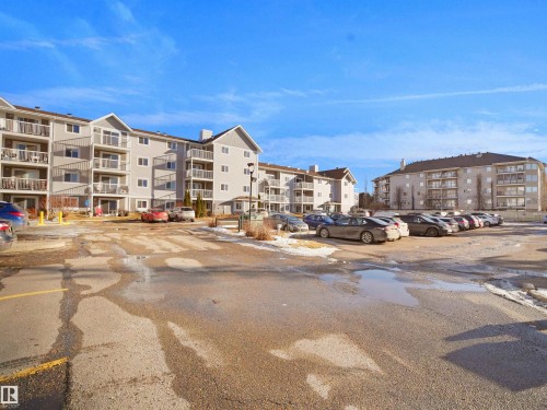 View of apartment building / complex with uncovered parking - 108 5065 31 Avenue, Edmonton, AB - Outdoor