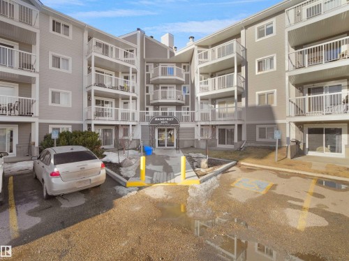 View of apartment building / complex with uncovered parking - 108 5065 31 Avenue, Edmonton, AB - Outdoor With Facade