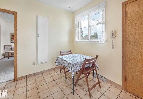 Dining room featuring light tile patterned floors - 11127 71 Avenue, Edmonton, AB - Indoor Photo Showing Other Room
