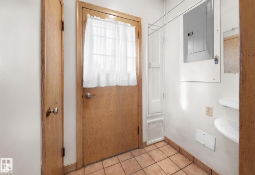 Bathroom with electric panel and light tile patterned flooring - 11127 71 Avenue, Edmonton, AB - Indoor