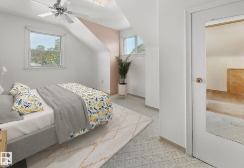 Bedroom with light colored carpet, ceiling fan, and lofted ceiling - 11127 71 Avenue, Edmonton, AB - Indoor Photo Showing Bedroom