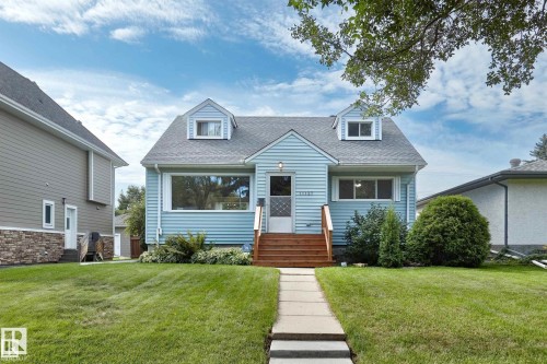 Cape cod home with a front yard and a shingled roof - 11127 71 Avenue, Edmonton, AB - Outdoor With Facade