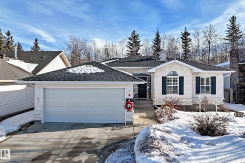 Ranch-style home featuring a chimney, stucco siding, driveway, a garage, and a shingled roof - 4 Harriott Court, St. Albert, AB - Outdoor With Facade