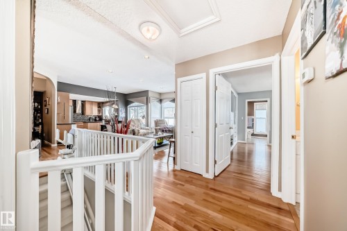 Hallway featuring light wood finished floors and a textured ceiling - 4 Harriott Court, St. Albert, AB - Indoor Photo Showing Other Room