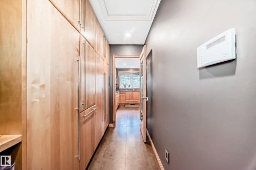 Hallway with dark wood-style flooring and recessed lighting - 4 Harriott Court, St. Albert, AB - Indoor Photo Showing Other Room